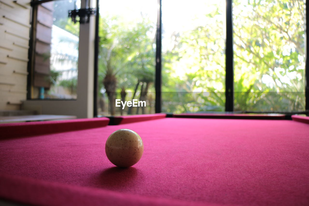 ball, sports, pool ball, pool sport, pool table, table, billiards, leisure activity, recreation, window, indoor games and sports, indoors, pool cue, relaxation, leisure games, billiard room, game, billiard table, sphere, recreation room, lifestyles, individual sports, cue ball, no people, snooker