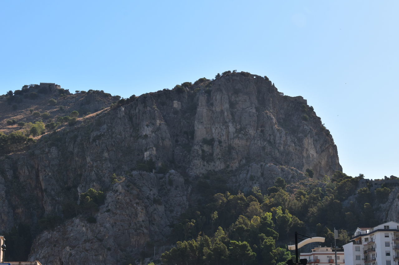 SCENIC VIEW OF MOUNTAINS AGAINST BLUE SKY