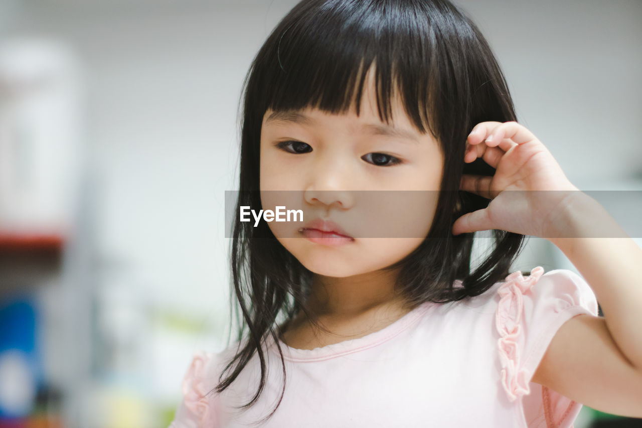 Close-up of cute girl at home