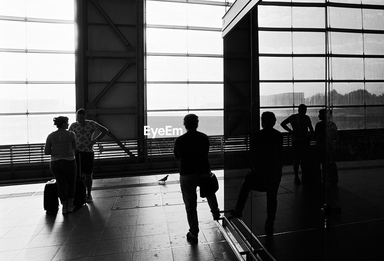 MEN WALKING IN CITY