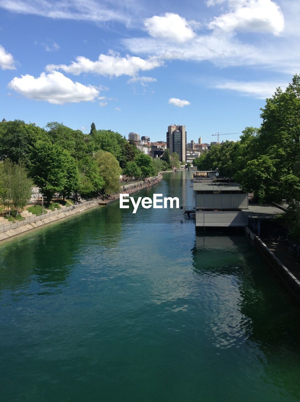 RIVER WITH BUILDINGS IN BACKGROUND