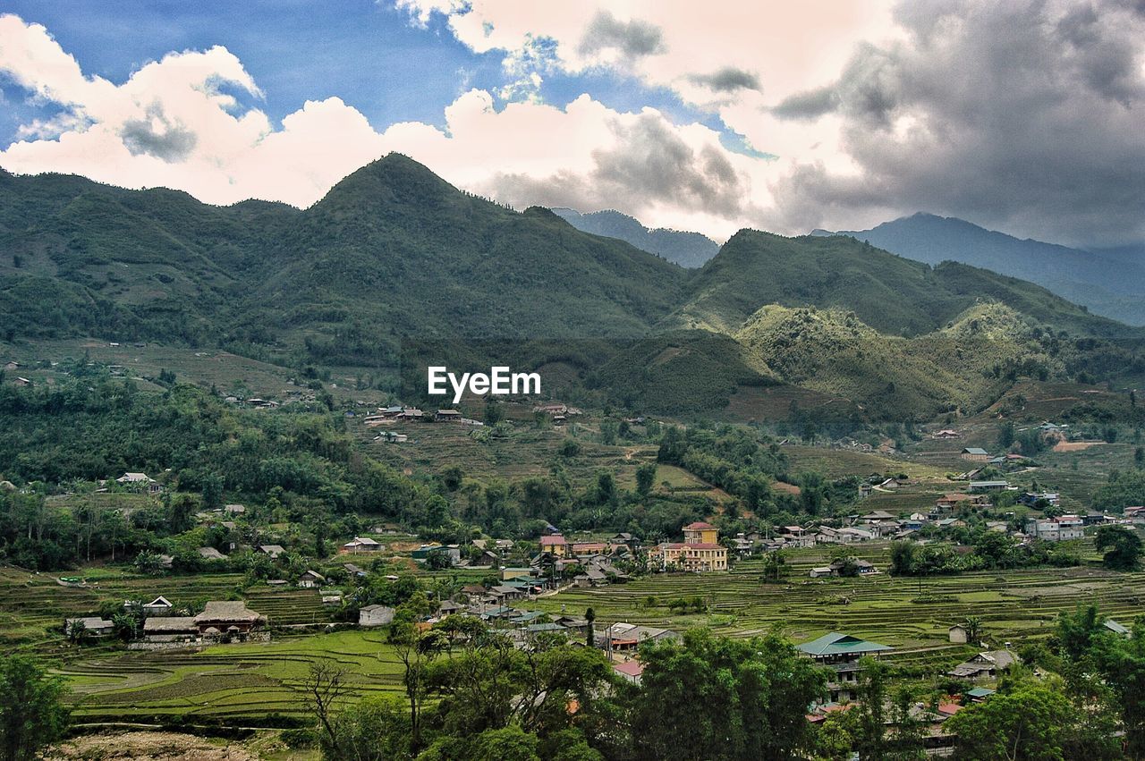 Scenic view of landscape and mountains against sky