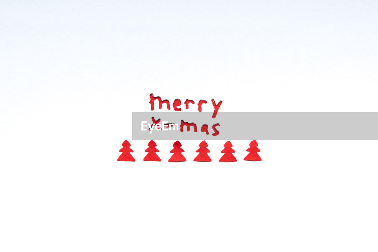 Close-up of christmas text on white paper