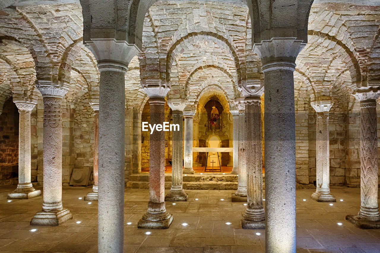 Interior of an old underground crypt with an altar