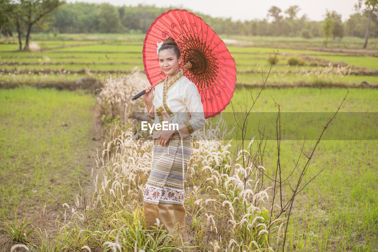 Woman standing in field