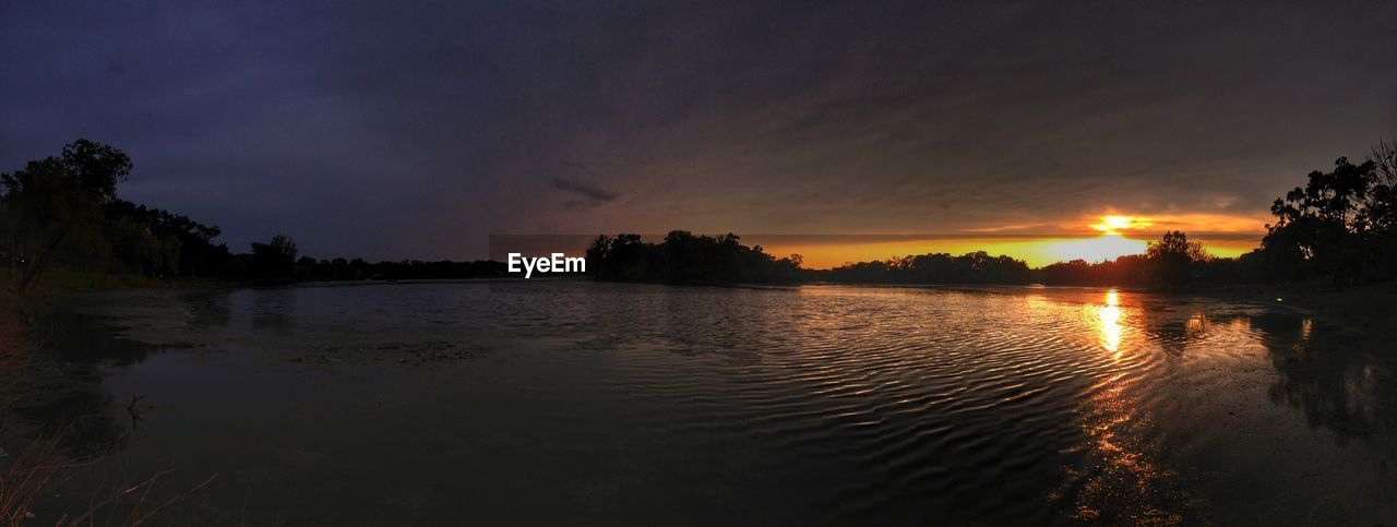 SCENIC VIEW OF SUNSET OVER LAKE