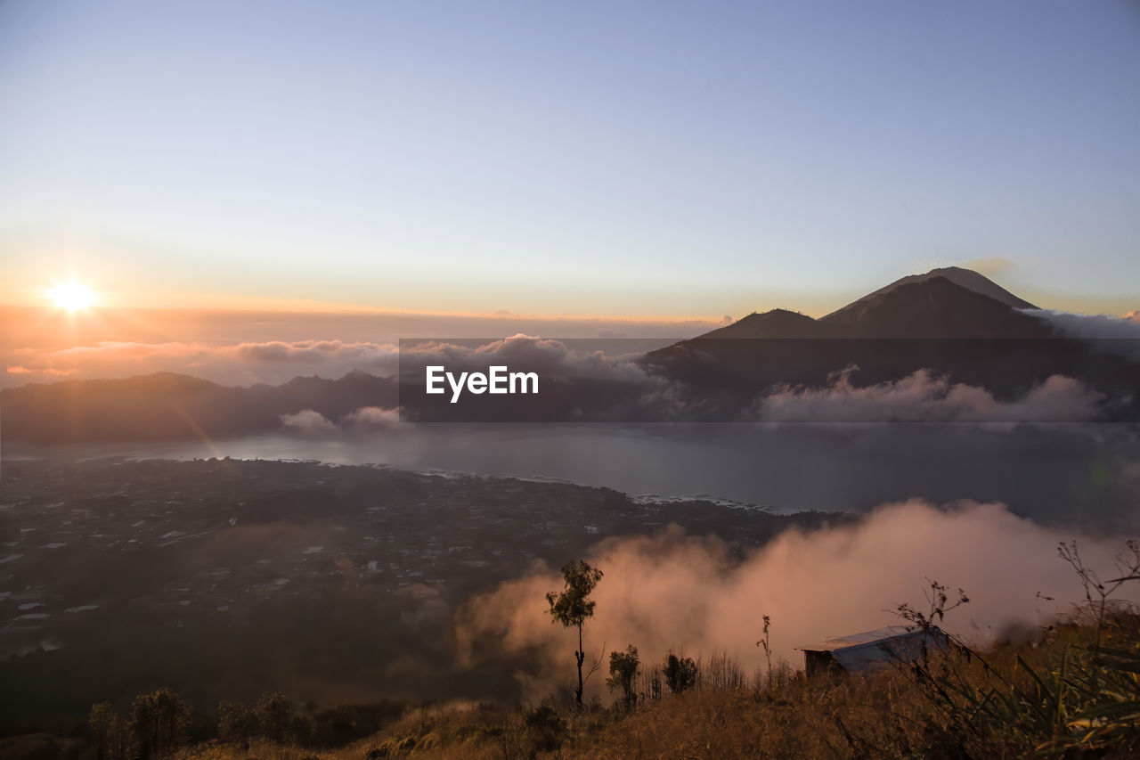 Sunrise on agung volcano and batur lake aerial view, bali, indonesia