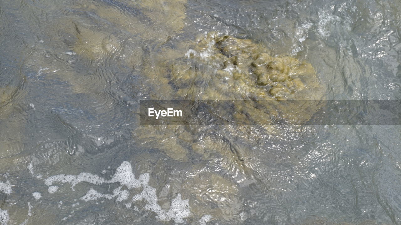 HIGH ANGLE VIEW OF FROZEN SEA SHORE DURING WINTER