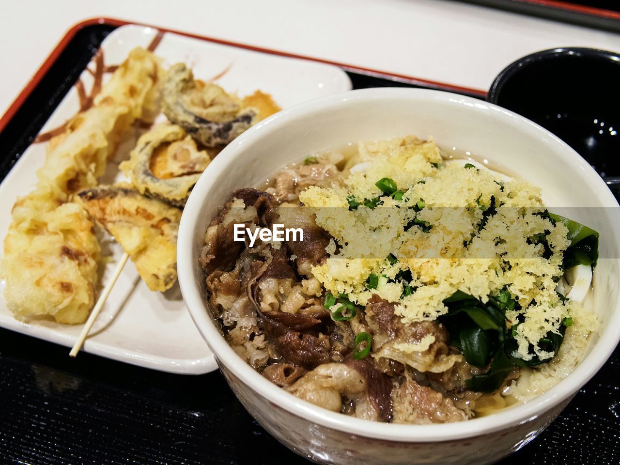 High angle view of served beef udon noodles in bowl