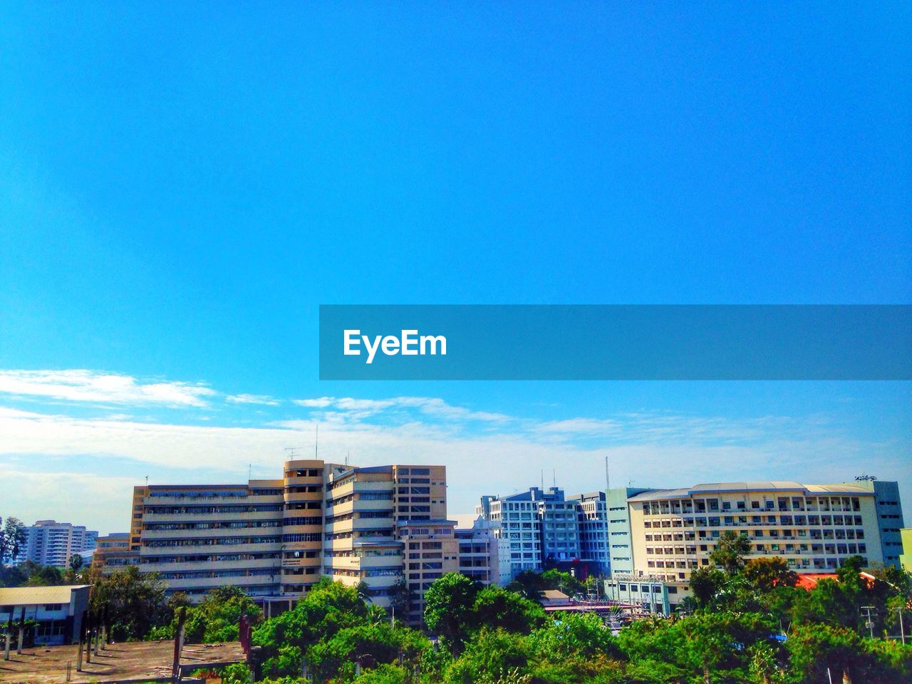 CITYSCAPE AGAINST BLUE SKY