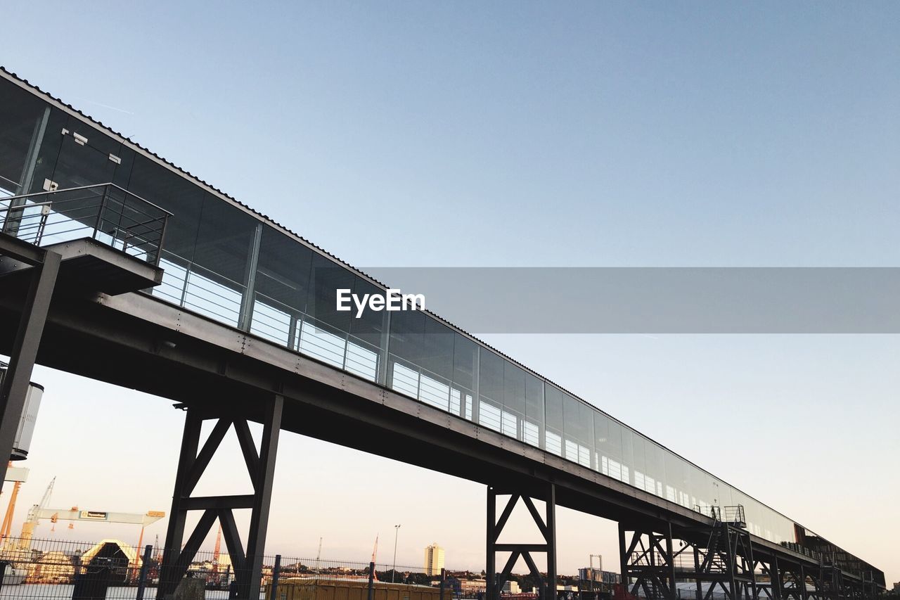 Low angle view of bridge against clear sky