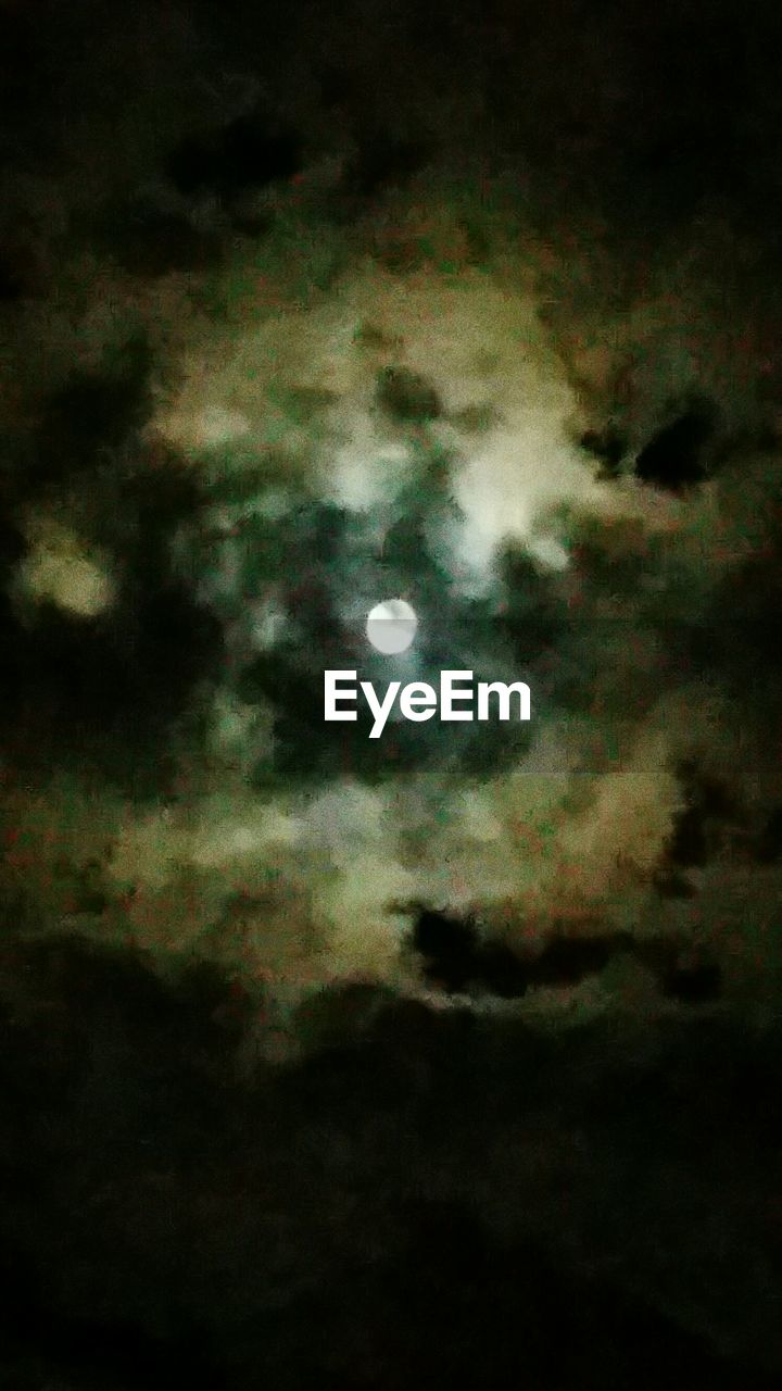 LOW ANGLE VIEW OF SILHOUETTE MOON IN SKY