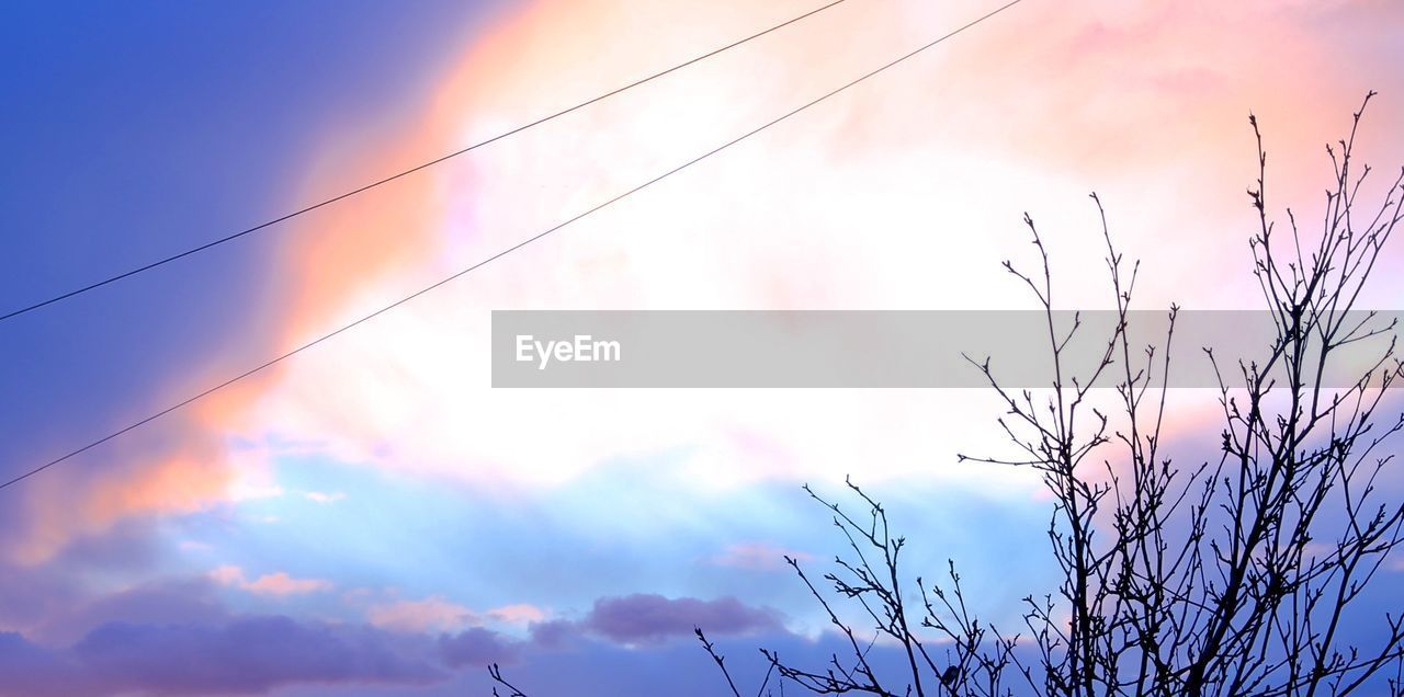 LOW ANGLE VIEW OF POWER LINES AGAINST SKY