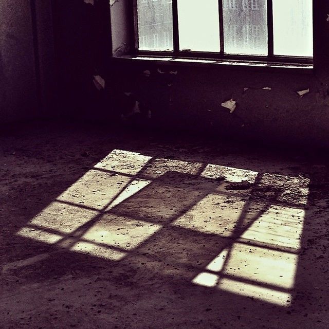 Sunlight falling on floor through window