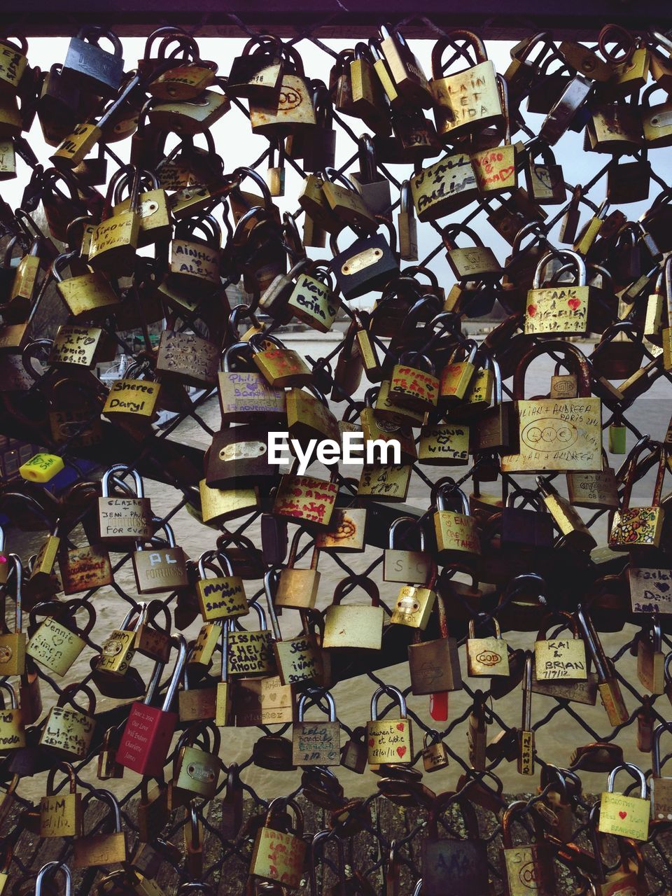 A wall of wires decorated with locks signed by lovers