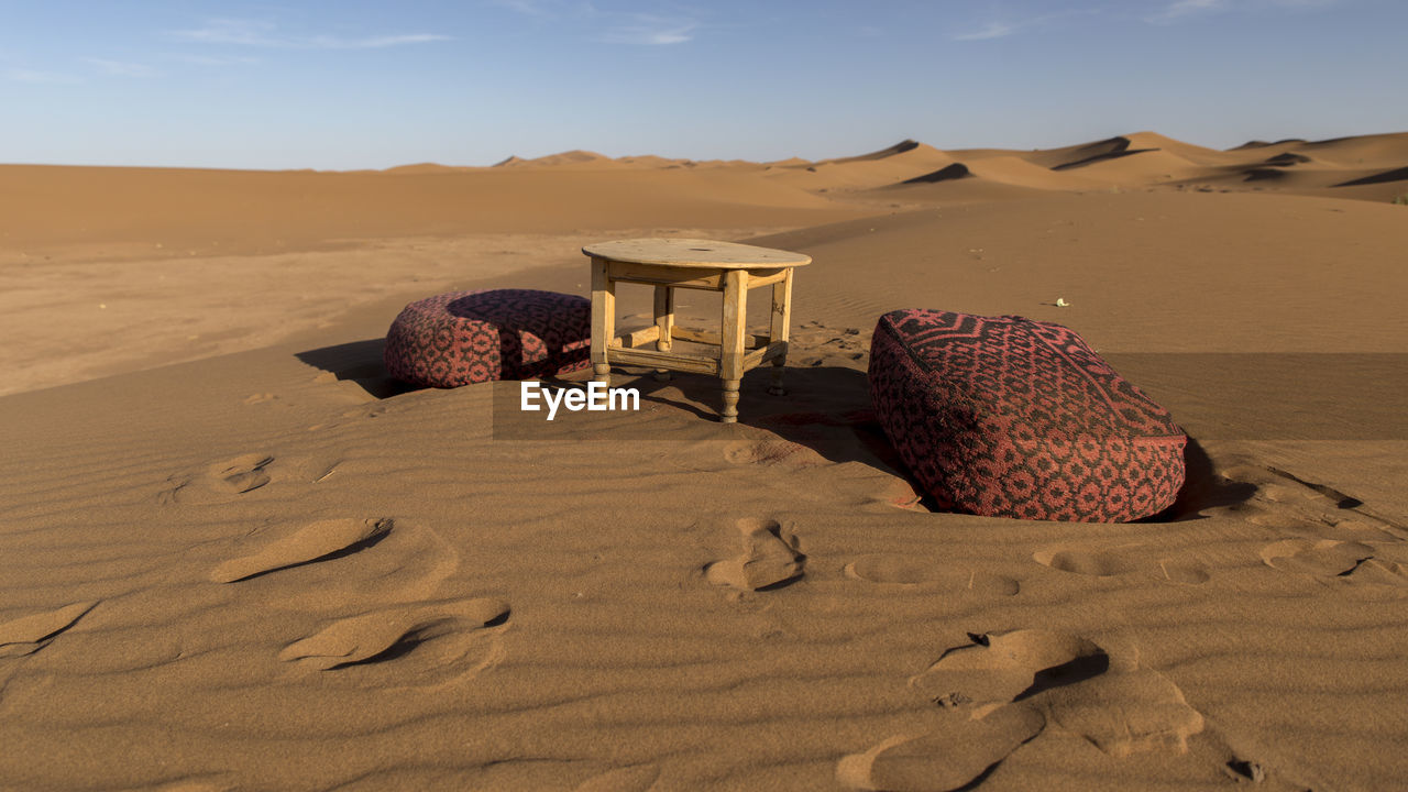 Sand dune in desert against sky