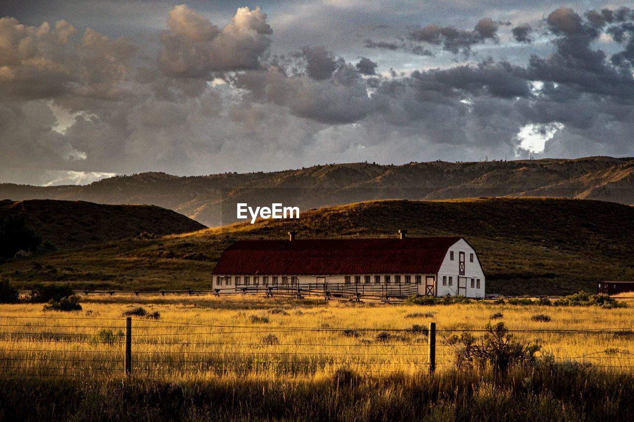 House on field against sky