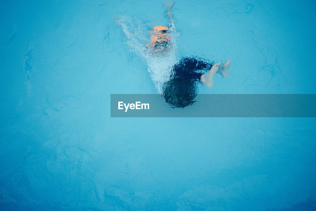 High angle view of man swimming in pool