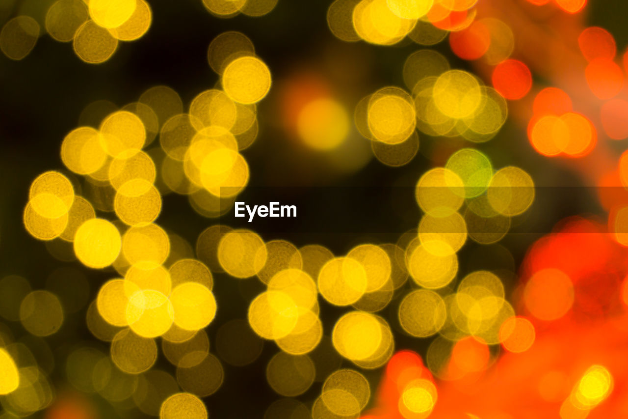 Defocused image of illuminated lights at night