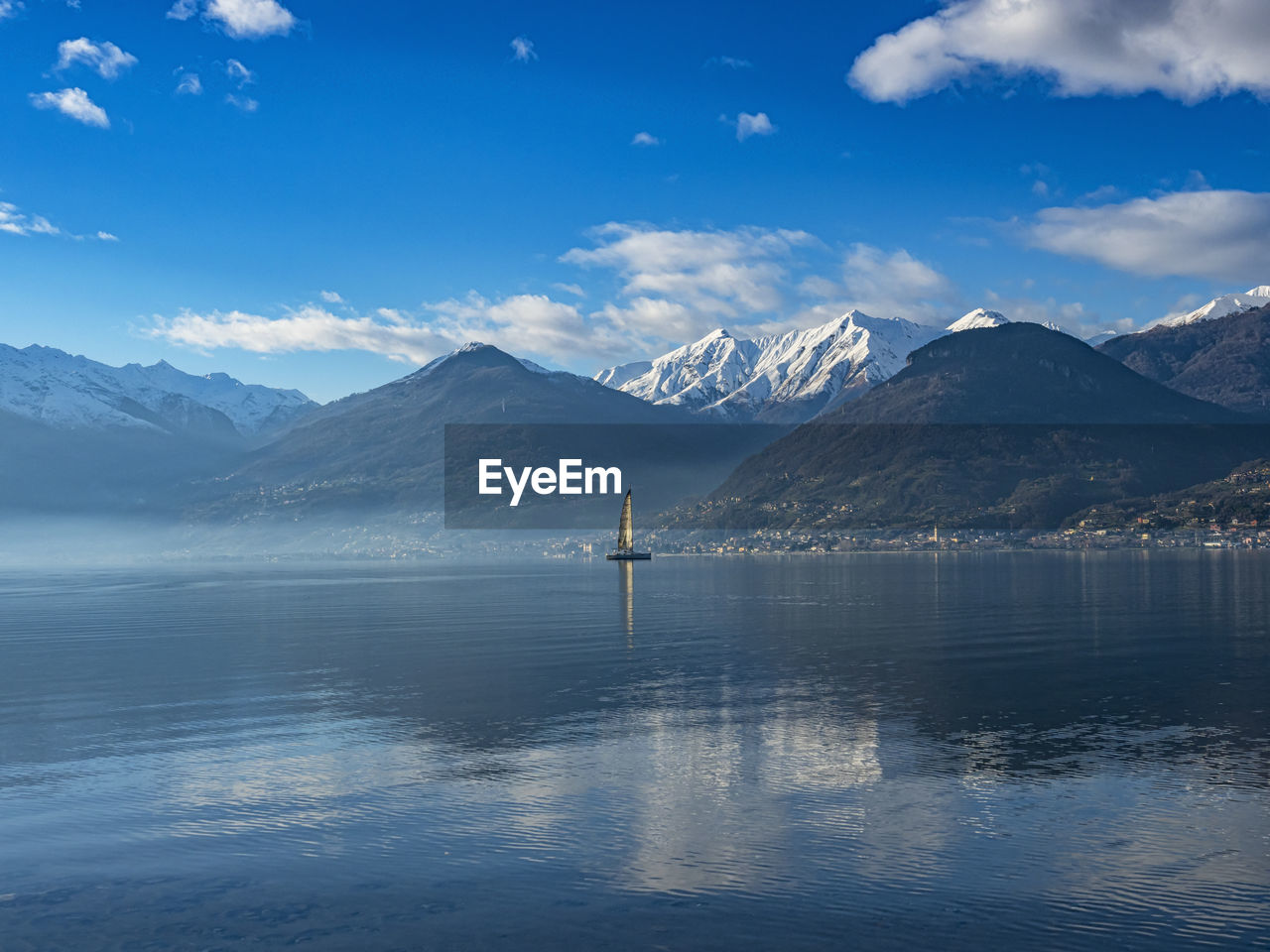 Single sail boat on lake como