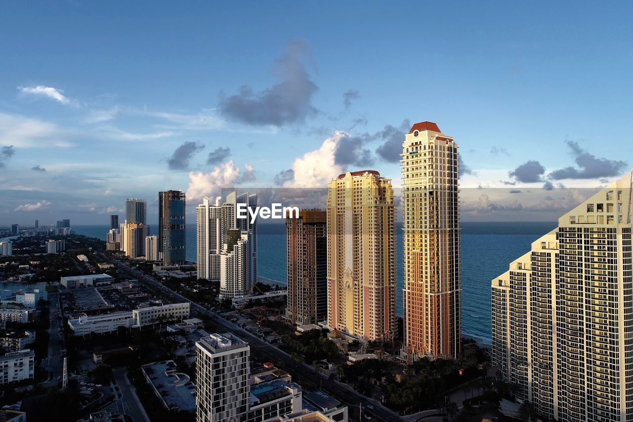 Panoramic view of modern buildings against sky