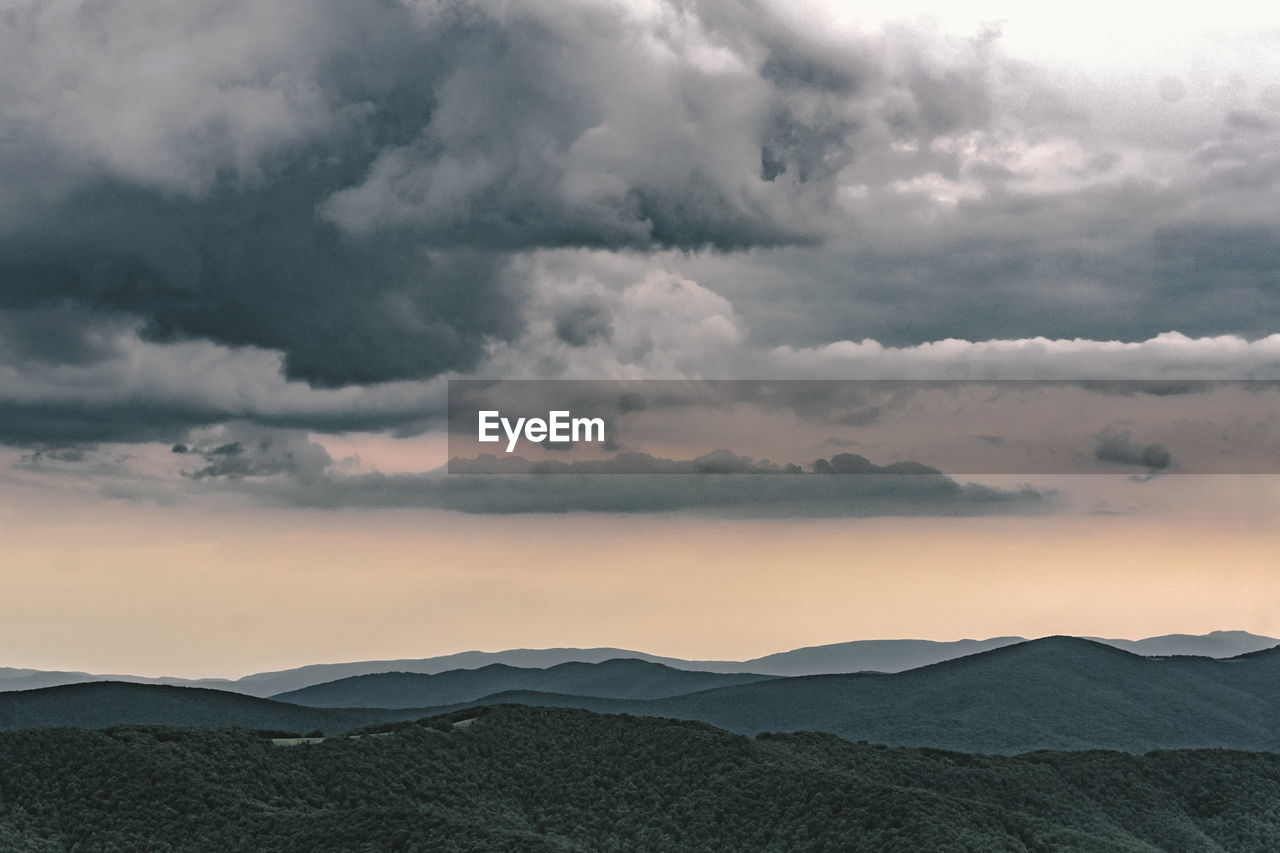 Scenic view of mountains against sky during sunset