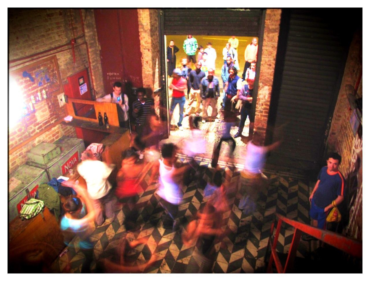group of people, transfer print, high angle view, men, auto post production filter, women, adult, large group of people, architecture, crowd, indoors, screenshot, sitting