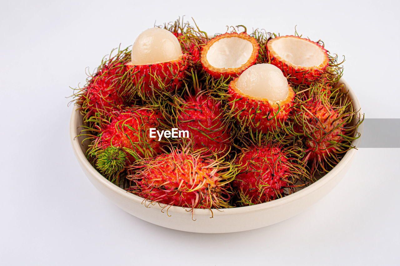 plant, food and drink, food, fruit, produce, healthy eating, rambutan, wellbeing, studio shot, red, no people, indoors, freshness, white background, still life, cut out