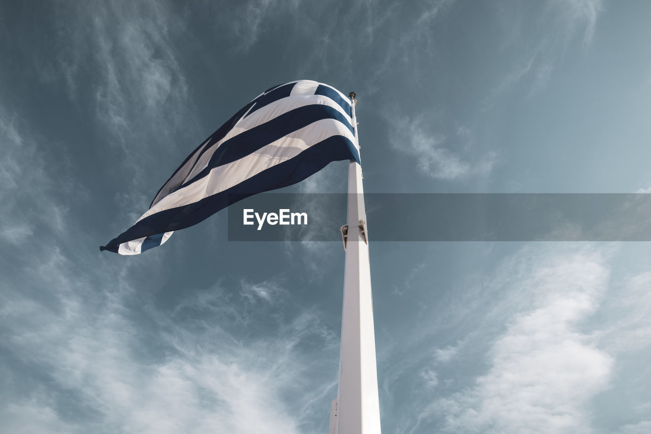 Low angle view of flag against sky