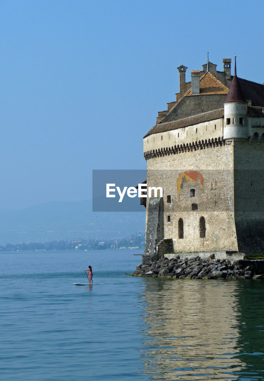 Castle chateau chillon at sea against clear sky