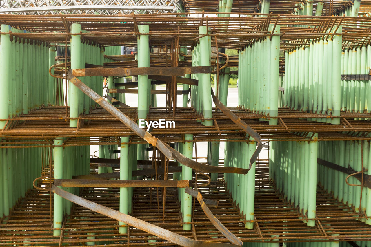 FULL FRAME SHOT OF BAMBOO STRUCTURE IN ROW