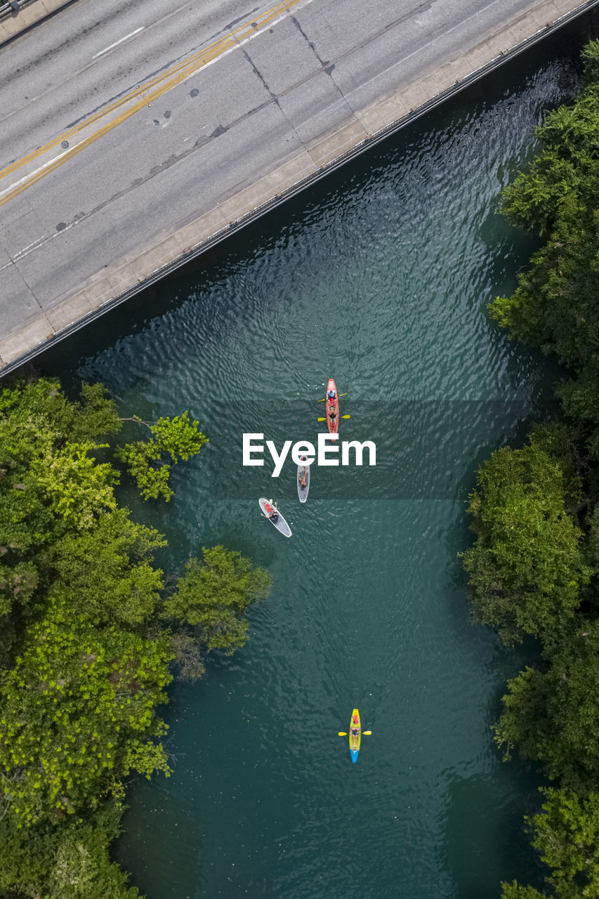 Aerial view of people kayaking in lake