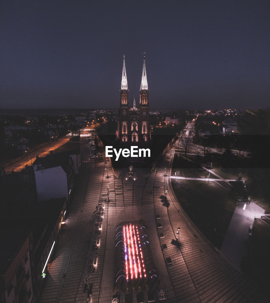 High angle view of illuminated city buildings at night