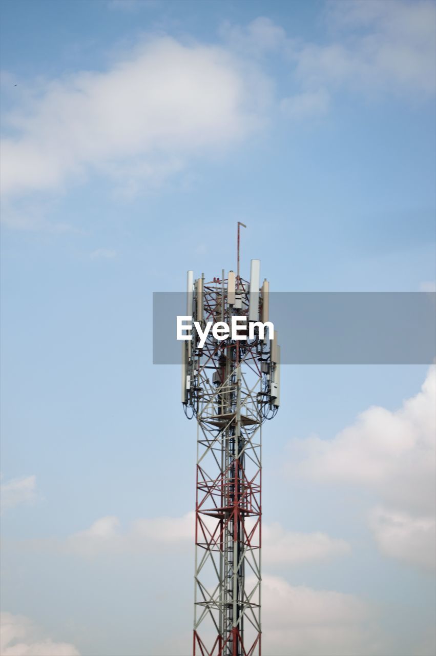 Low angle view of communications tower against sky