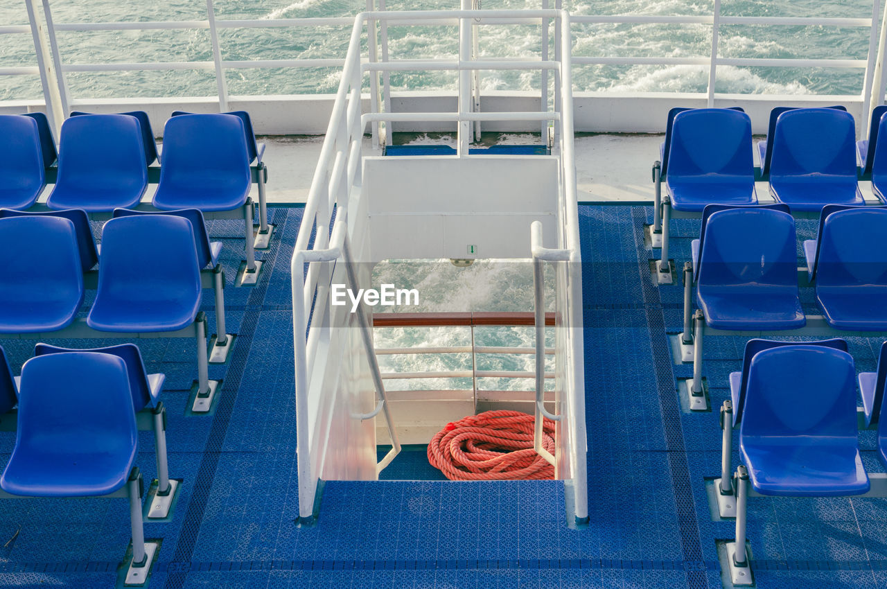 High angle view of empty chairs in a ferry boat