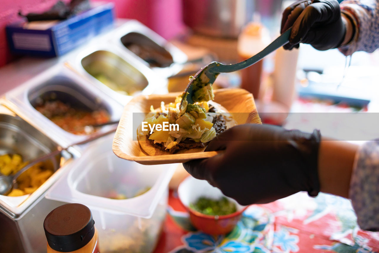 cropped hand of man holding food