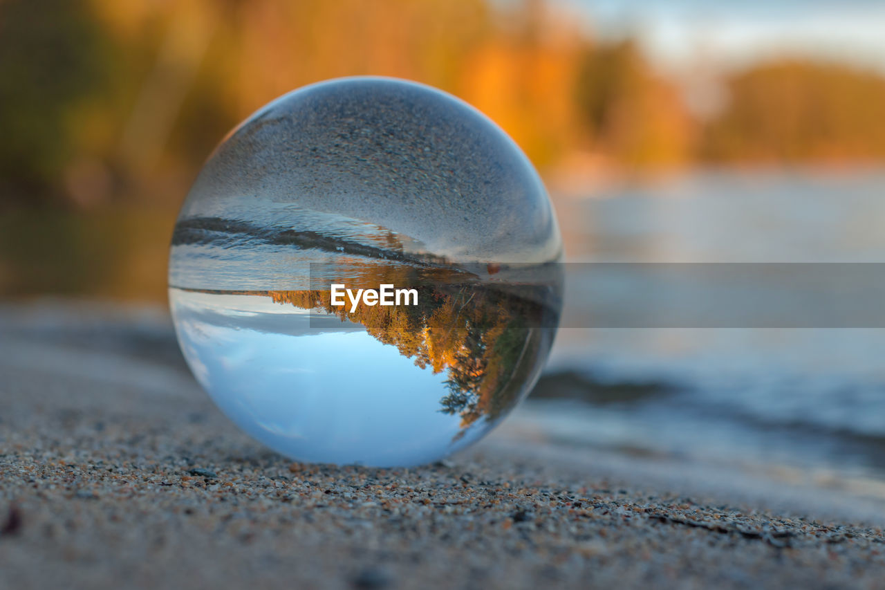 CLOSE-UP OF CRYSTAL BALL IN WATER