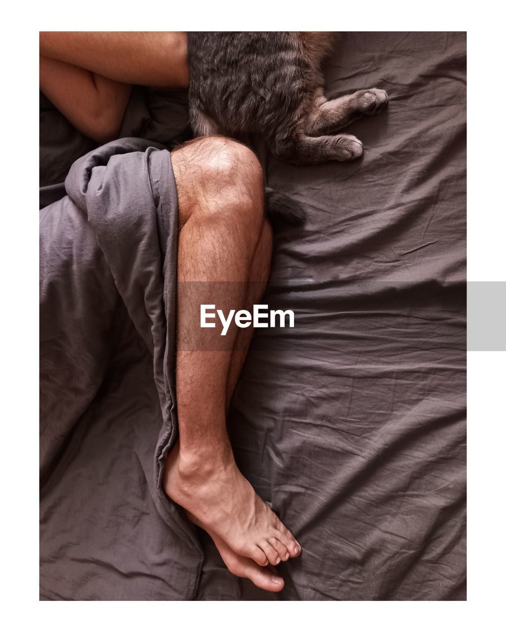 MAN LYING ON BED