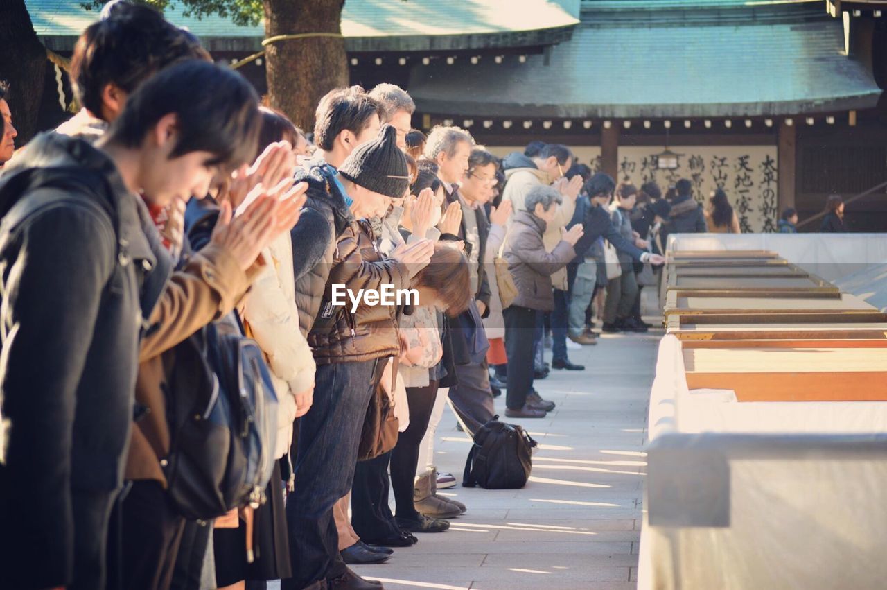 People praying at japanese temple