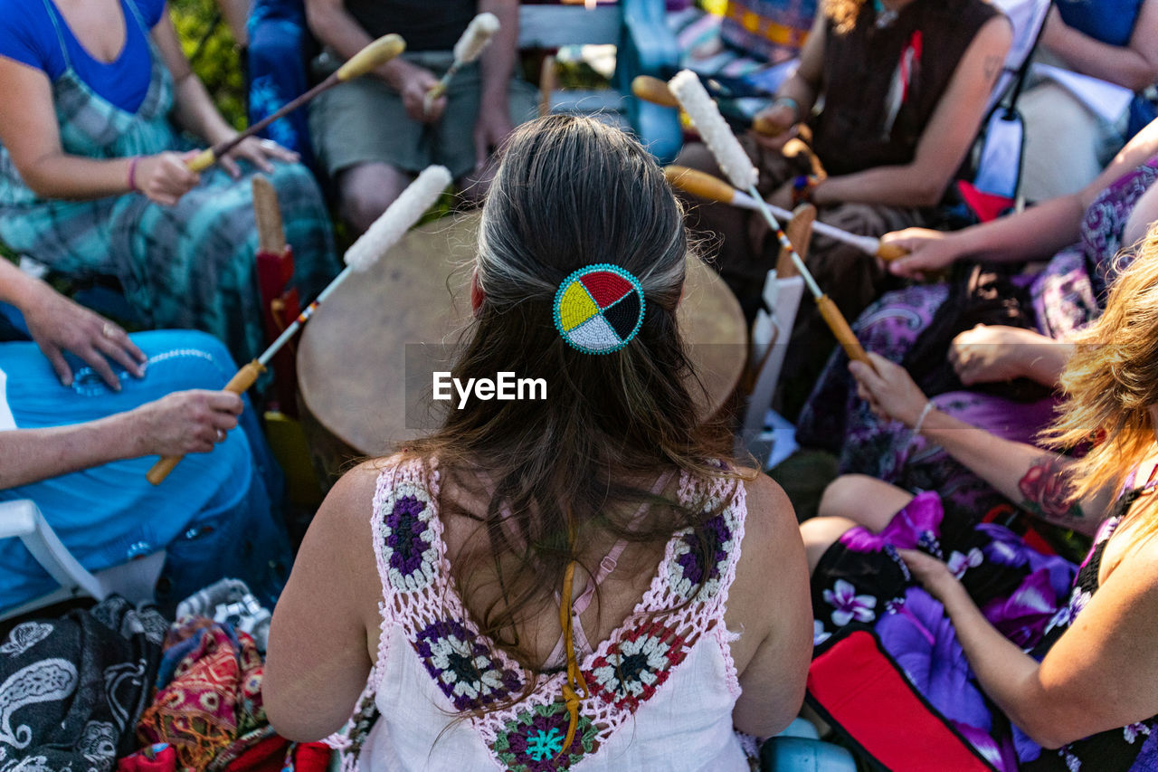 High angle view of people sitting at music festival