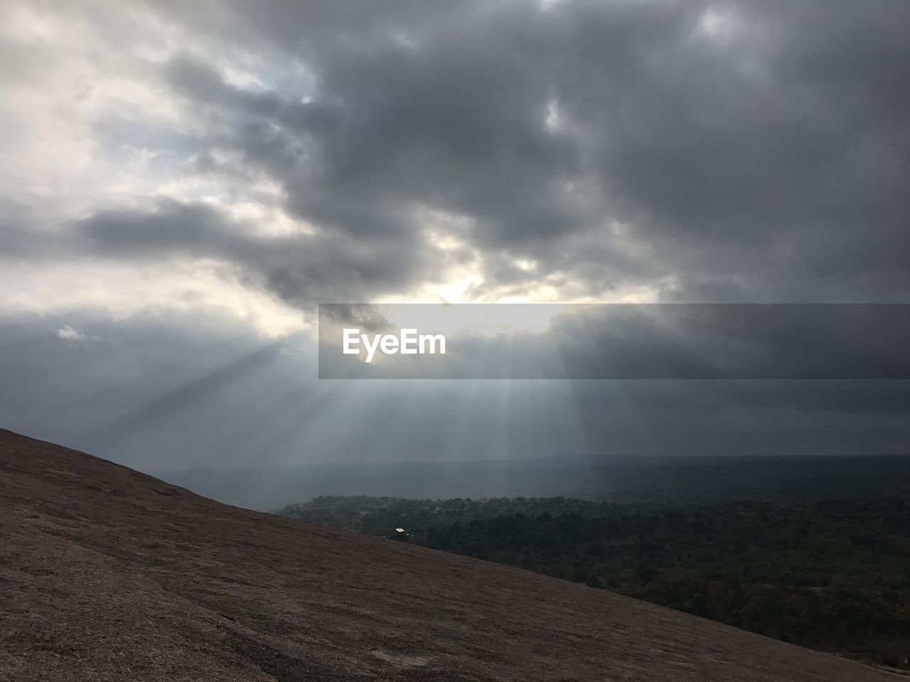 SCENIC VIEW OF STORM CLOUDS OVER LANDSCAPE