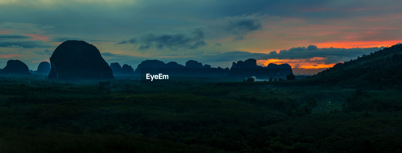 Scenic view of silhouette landscape against sky during sunset