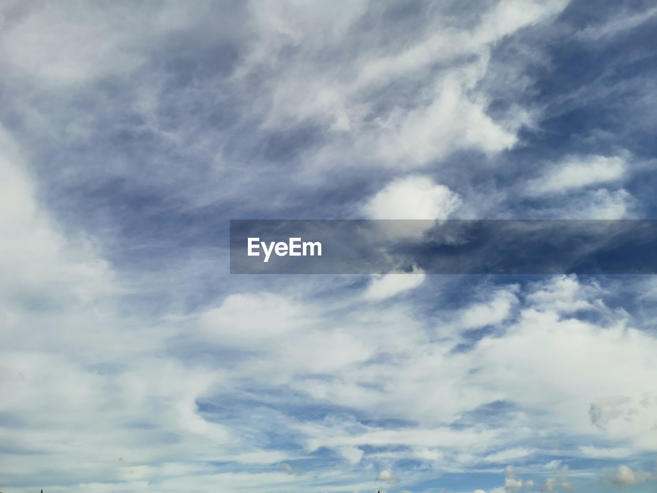 LOW ANGLE VIEW OF CLOUDS IN BLUE SKY