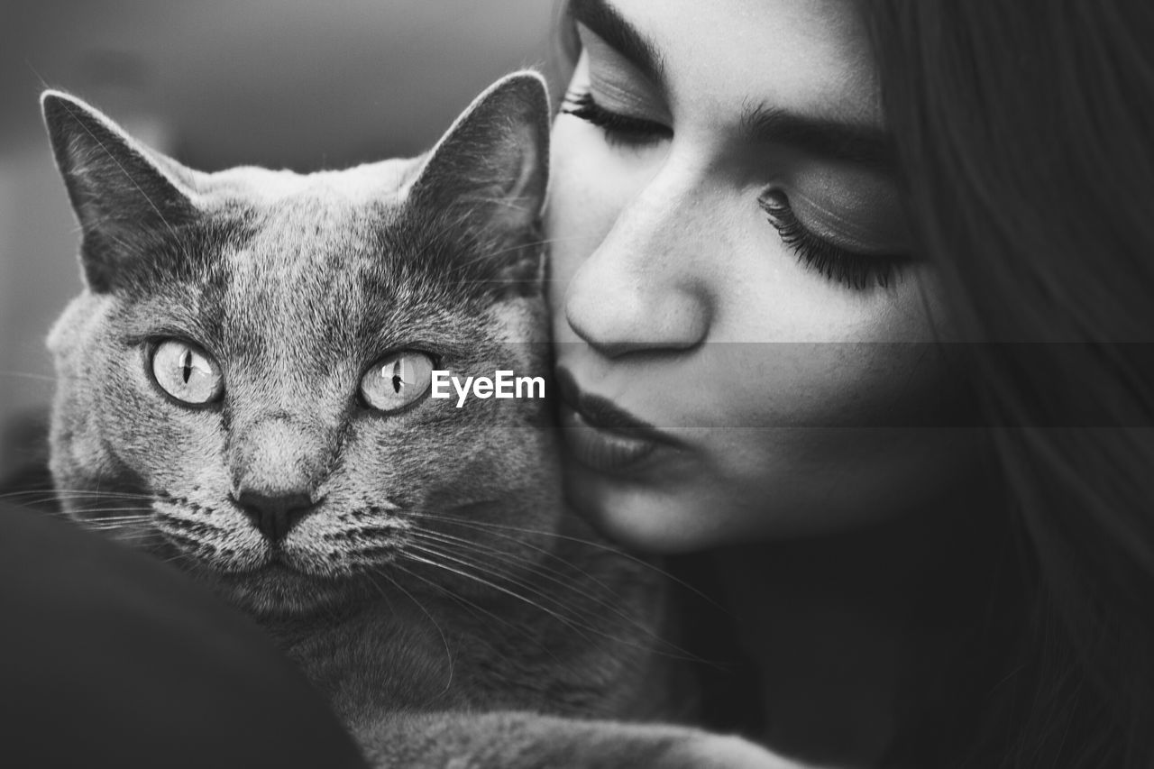 Close-up of beautiful woman with cat