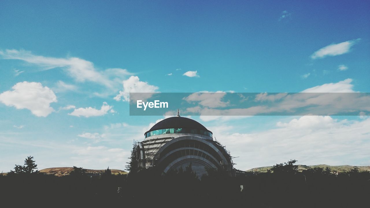 Low angle view of building against blue sky