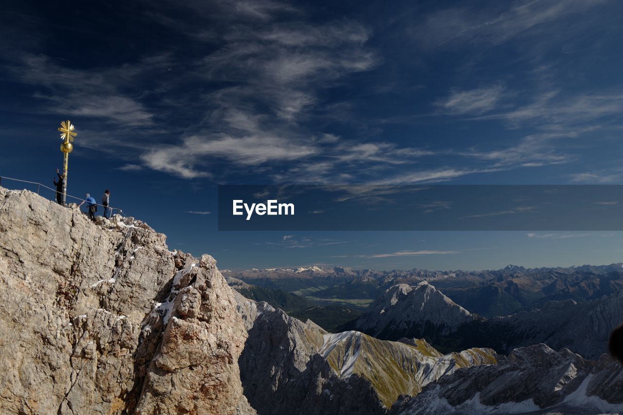 ROCKS ON MOUNTAIN AGAINST SKY