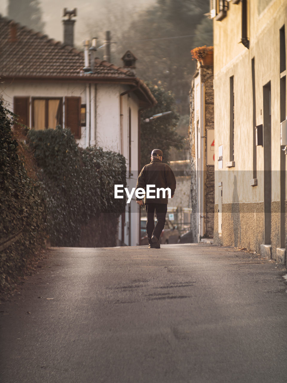 Rear view of man walking in city