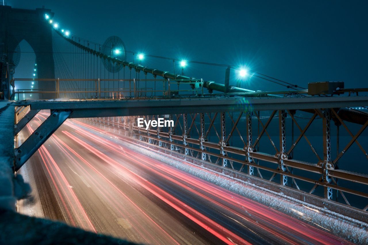 Light trails on suspension bridge at night