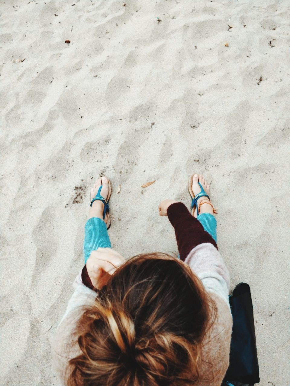 LOW SECTION OF WOMAN ON BEACH