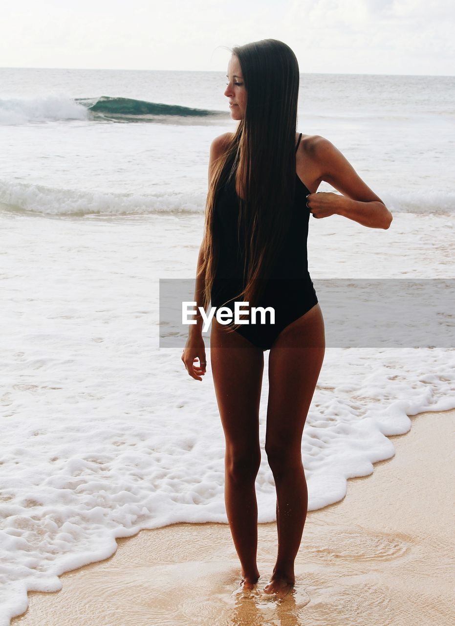 Woman standing at beach
